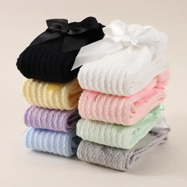 ถุงเท้ายาวถึงเข่าประดับโบว์สีพื้น สําหรับเด็ก Set 12 pcs.